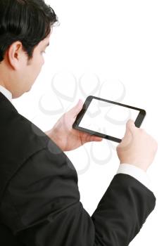 Businessman holding a blank touchpad pc, one finger touches the screen, focus on the touchpad