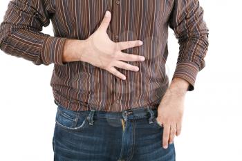 man holding his stomach in pain or indigestion 