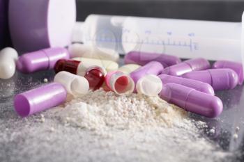 Royalty Free Photo of Open Capsules and a Syringe