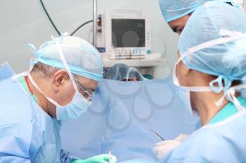 surgeons team working in the operation room