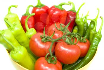 Royalty Free Photo of a Bowl of Peppers and Tomatoes