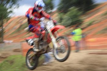 Motorcross rider, abstract image created with intentional motion blur and zooming effect.
