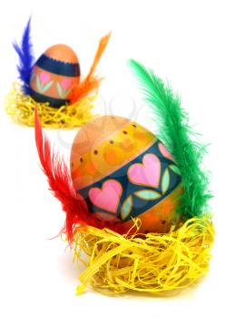 Easter egg race. Wings made of color feathers. Isolated on white.