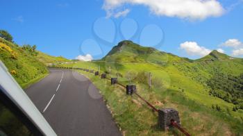 Driving on the road in Puy Mary, volcanic french mountains, Massif Central, France