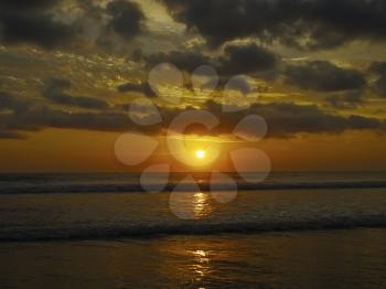 Setting sun over ocean, sunset cloudscape. Bali, Idonesia