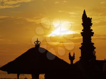 Traditional balinese roof and pillar silhouette at sunset, Tanah Lot, Bali, Indonesia
