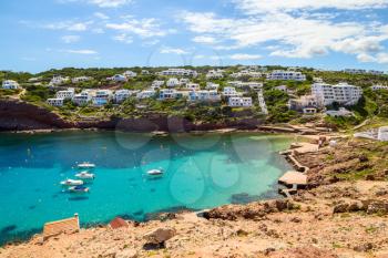 Cala Morell cove scenery in sunny day at Menorca, Spain.