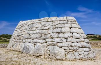 Naveta des Tudons - ancient megalithic chamber tomb at Menorca island, Spain. It served as collective ossuary between 1200 and 750 BC and represet one of the oldest ancient structures in Europe.