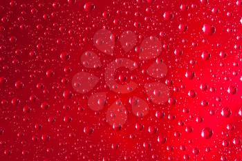Royalty Free Photo of a Closeup of Water Droplets on a Smooth Surface