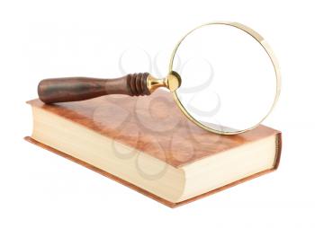 Royalty Free Photo of a Magnifying Glass and  Book