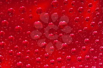 Royalty Free Photo of a Series of Water Drops on a Colored Background