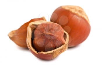 Royalty Free Photo of a Full and Cracked Hazelnuts