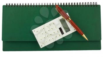 Royalty Free Photo of a Pen and Calculator Sitting on Top of a Binder