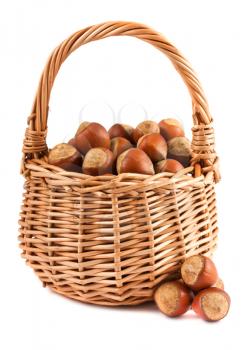 Royalty Free Photo of a Wicker Basket Filled with Hazelnuts