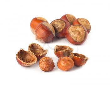 Royalty Free Photo of Two Piles of Hazelnuts Some Out of their Shells