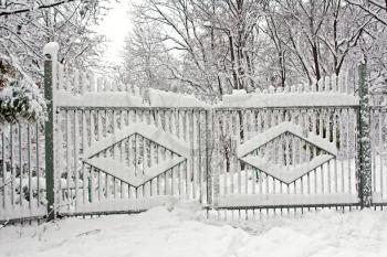 Royalty Free Photo of Gates Covered in Snow