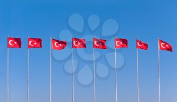Line of turkish flags in blue sky