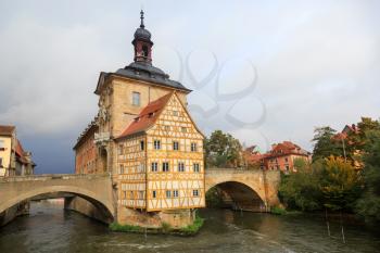 Obere bridge (brücke) and Altes Rathaus and cloudy sky in Bamberg, Germany
