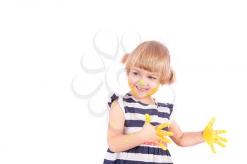 Small girl with yellow paint on her palms isolated on white
