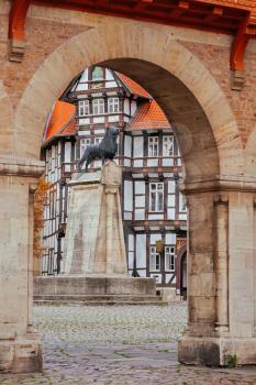 Lion statue and old timbered house in Braunschweig patio, Germany
