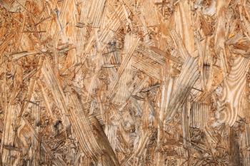 Particleboard background made from used wood
