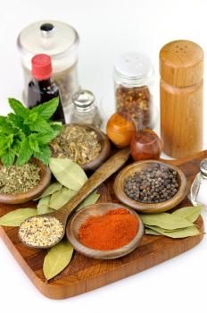 spices arrangement on a wooden cutting board 