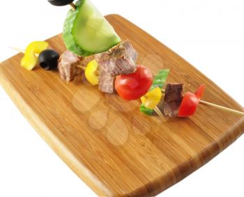 fresh beef steak with vegetables on a cutting board