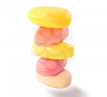 a stack of colored soap bars on white background