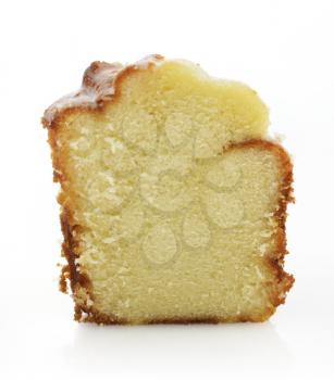Slice Of Sour Cream Cake On White Background