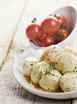 Mozzarella Cheese And Cherry Tomatoes In White Bowls