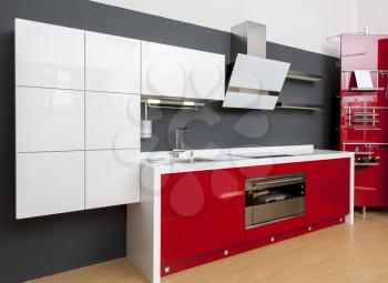 Modern kitchen interior with red decoration 