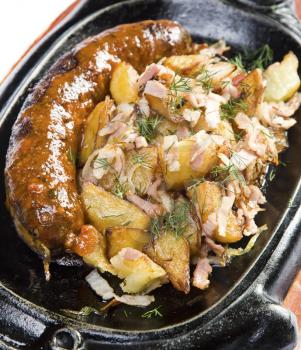 Fried potatoes with grilled sausages