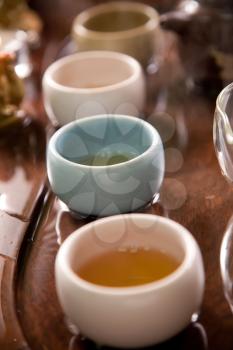 Tea cups on wooden table 
