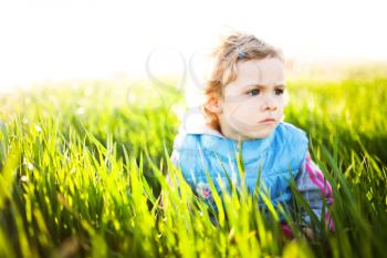 Adorable little girl taken closeup outdoors in summer