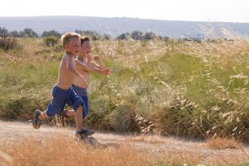 two children running in the nature