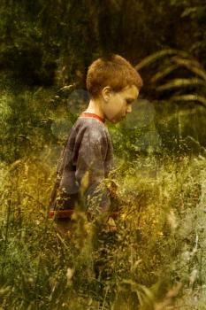 Vintage picture of a young child walking in nature