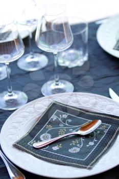 Decorative  table serving. Glasses and plates.