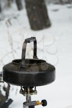 Royalty Free Photo of a Tea Kettle on a Gas Burner