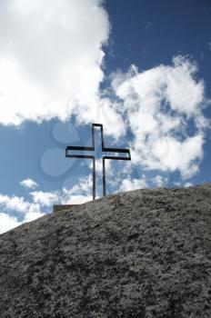 Royalty Free Photo of a Cross on a Hilltop