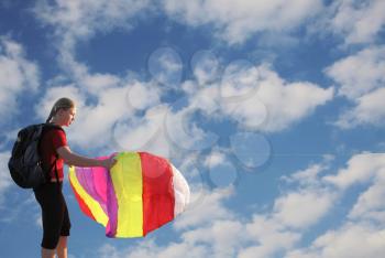 Royalty Free Photo of a Woman Flying a Kite