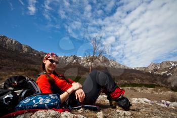 Royalty Free Photo of a Woman Resting While Hiking