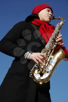 Royalty Free Photo of a Woman Playing Saxophone