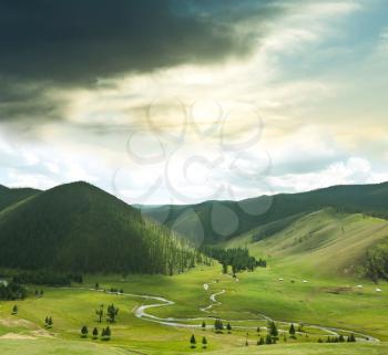 Royalty Free Photo of a Field and Mountains