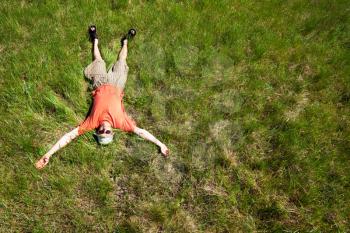 Royalty Free Photo of a Man Laying in a Field