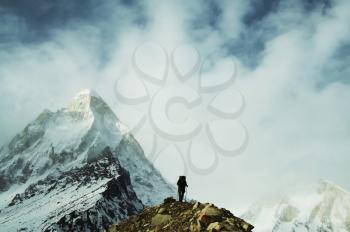 Royalty Free Photo of a Climber with Shivling Peak the Background