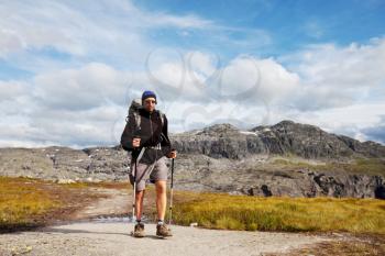Royalty Free Photo of a Man Hiking in the Mountains of Norway