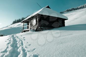 Royalty Free Photo of a Cabin in the Wintertime