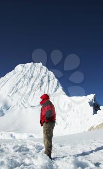 Royalty Free Photo of a Mountaineer Looking at the Alpamayo Peak