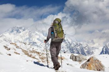 Climber in the Himalayan mountains on Everest background
