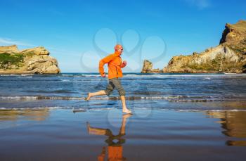 Running man in ocean coast